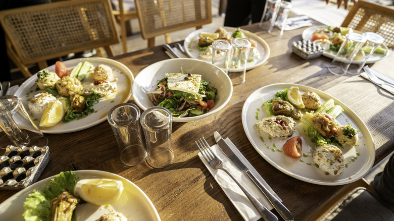 A table is set with Mediterranean diet dishes.