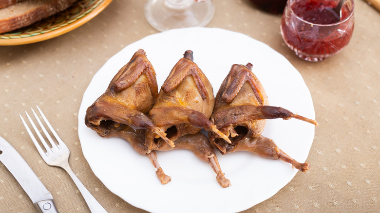 A trio of roasted partridges on a plate
