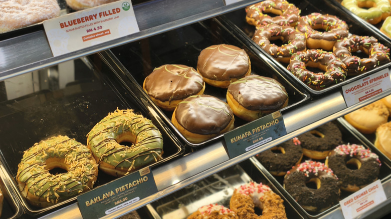 A display case of donuts at Dunkin.
