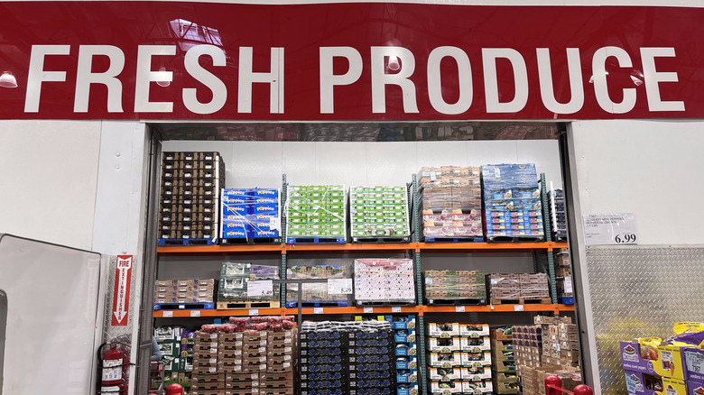 Fresh Produce sign above boxes of fruits and vegetables at Costco.
