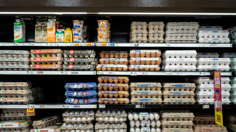 Egg cartons stacked on shelves at a Kroger store.