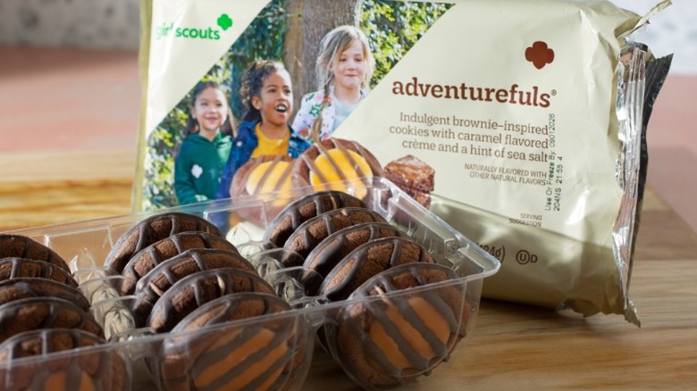 A full tray of Adventurefuls Girl Scout cookies sitting out next to its outer packaging.