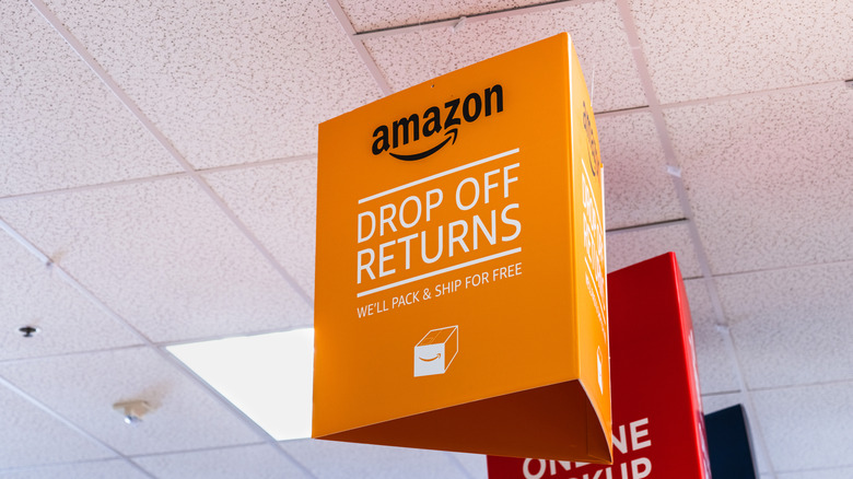 A sign indicating a drop-off point for Amazon returns.