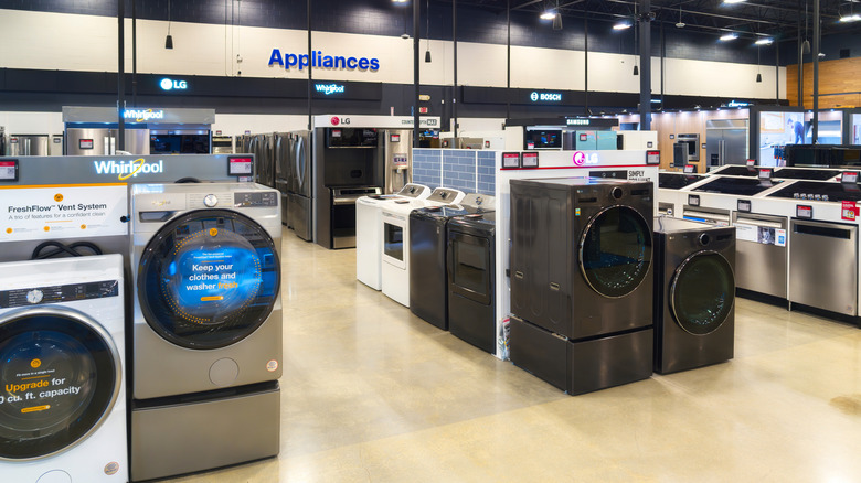 Best Buy appliance section with washers and refrigerators