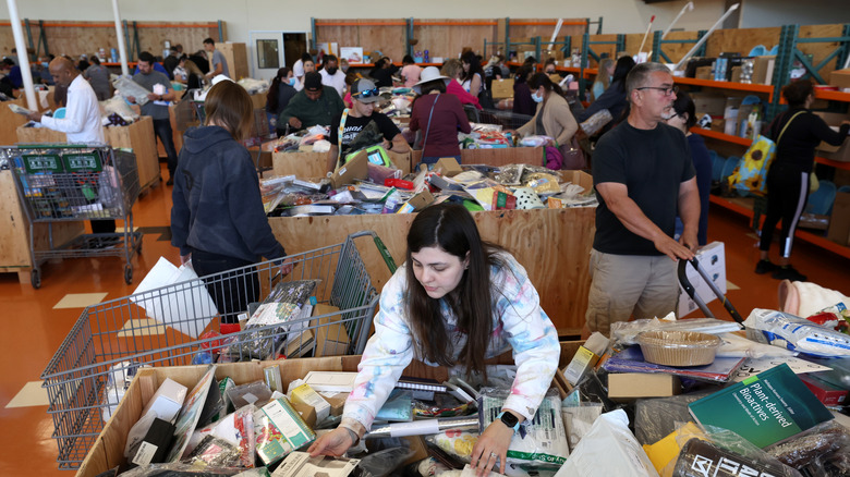 Customers shopping from bargain bins.