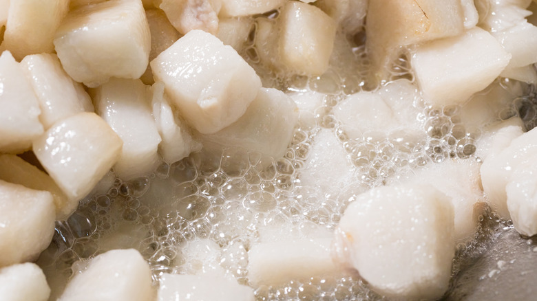 Diced meat being heated to render fat