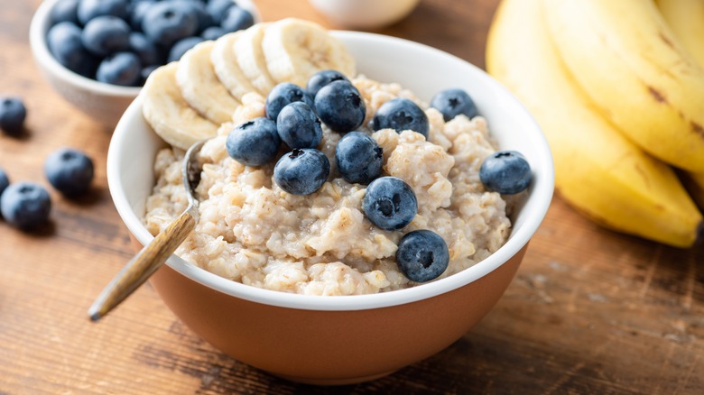 a bowl of oatmeal with blueberries and banana