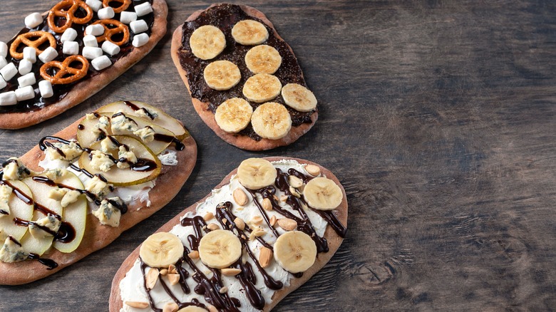 A mix of beavertails on a wooden table