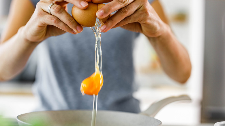 cracking egg into bowl