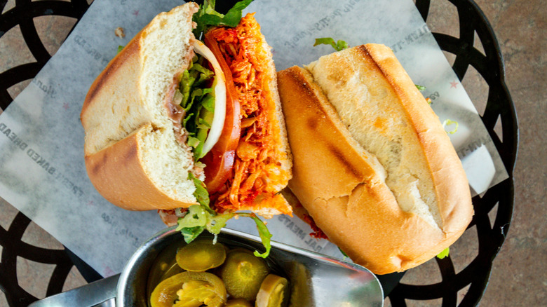 Mexican-style torta cut in half in a basket