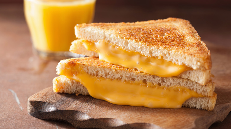 Grilled cheese sandwich halves with melty cheese
