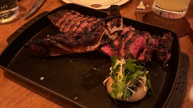 A sliced bone-in steak from The Eighty Six steakhouse in New York City.