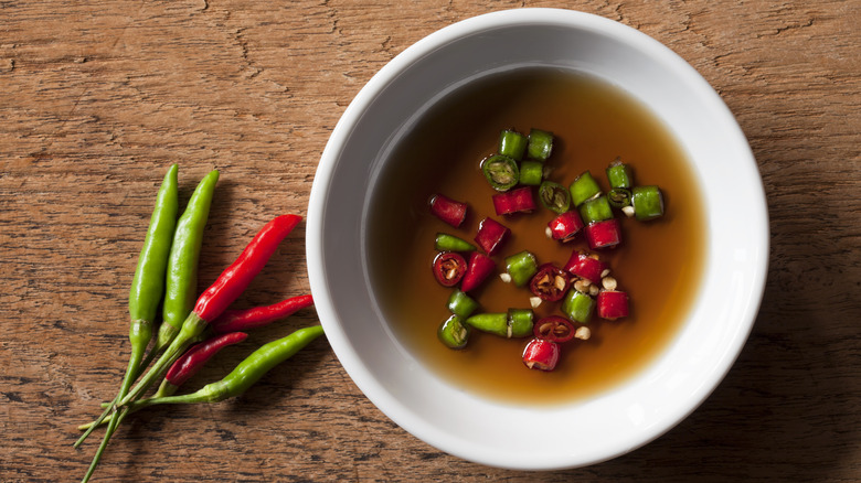 Bowl of fish sauce with chili peppers