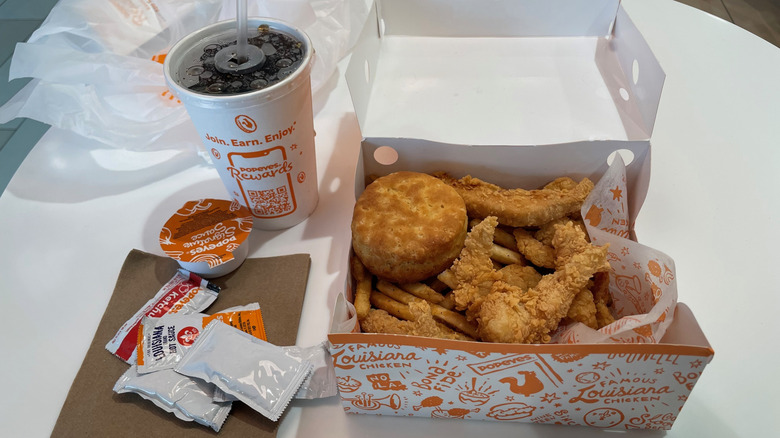 The Popeyes Surf and Turf Tackle Box includes tenders, shrimp, fries, and a biscuit
