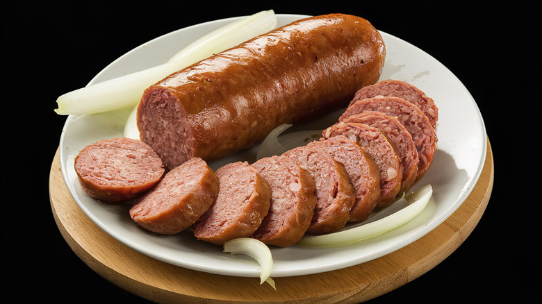 A chub and slices of Lebanon bologna on a plate