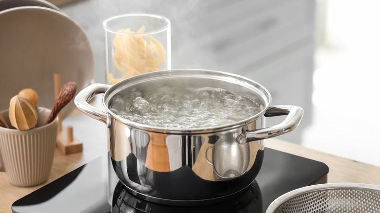 A boiling pot in a clean kitchen.