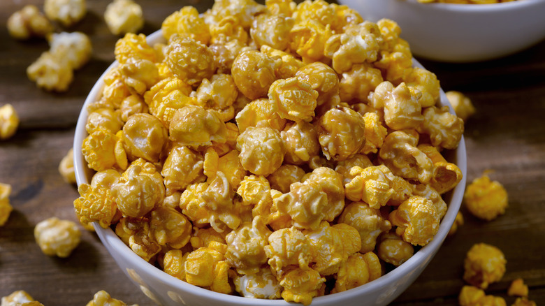 Caramel and cheddar popcorn mix in a bowl