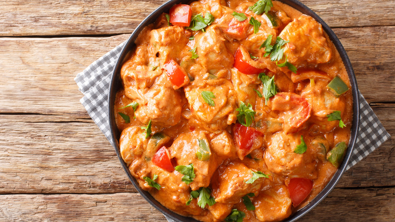 a pot of chicken mafe