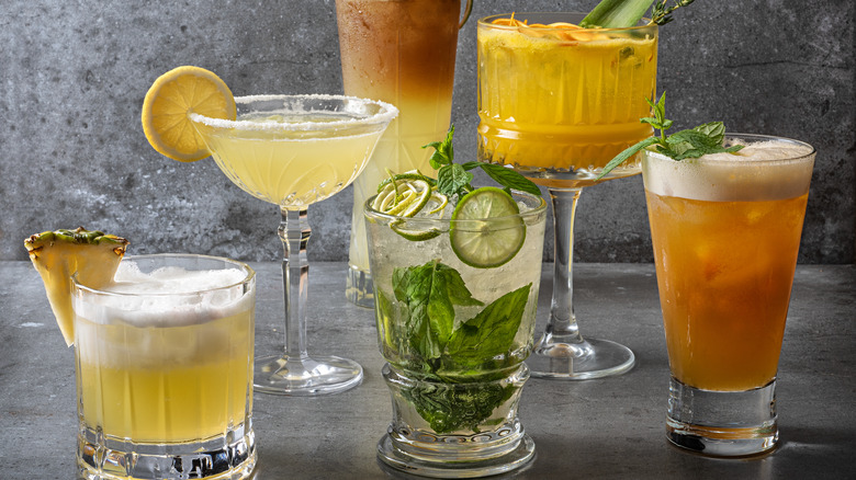 different cocktails arranged on a gray surface