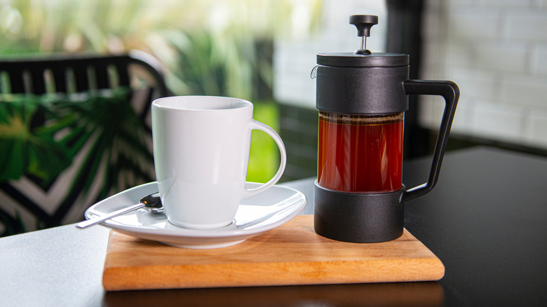 French press coffee with white cup