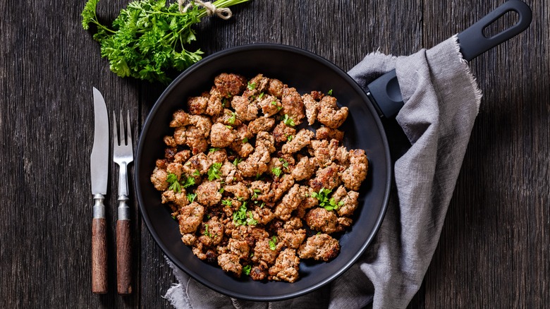 Cooked ground Italian sausage in a skillet