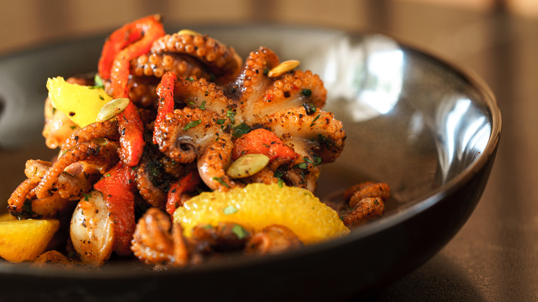 Octopus with garnish and herbs