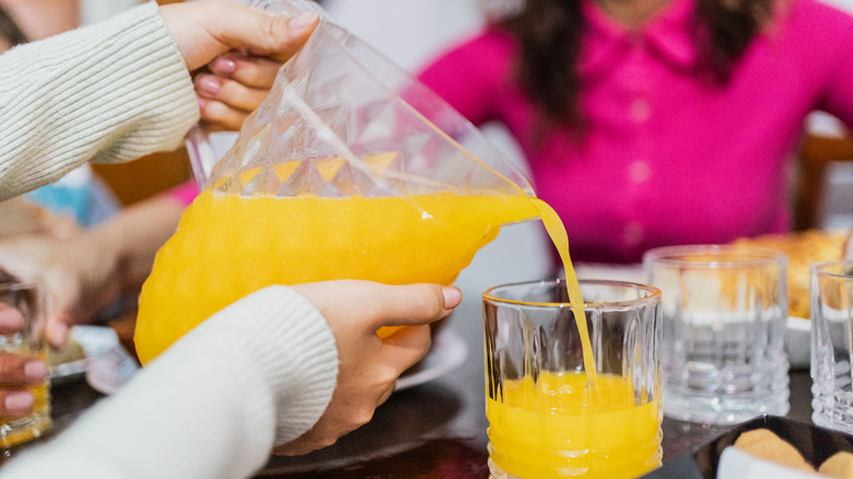 pouring orange juice