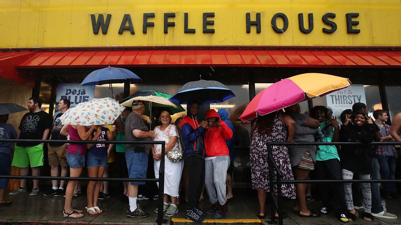 Waffle House customers wait in the rain
