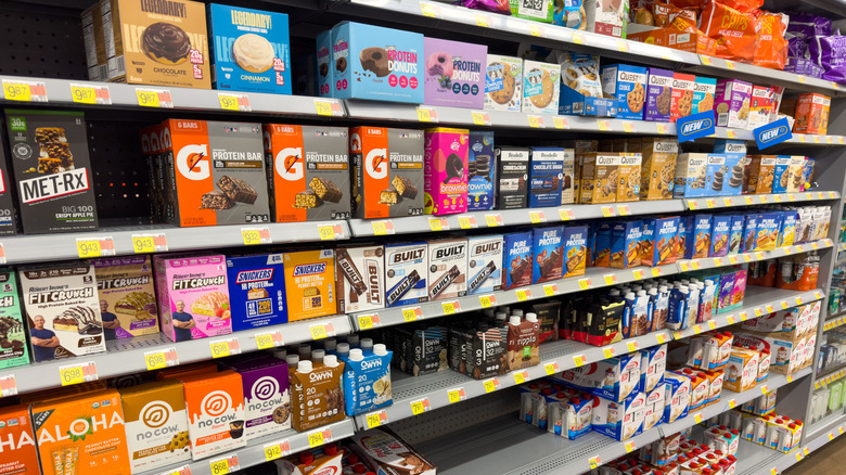 Protein bars displayed on a grocery store shelf