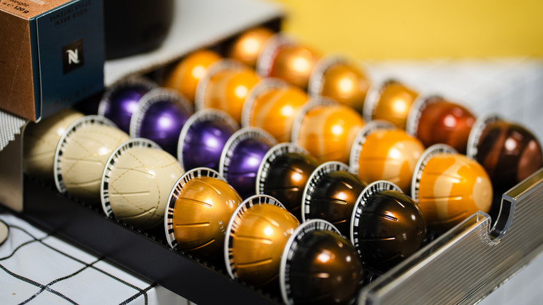 nespresso pods lined up inside a drawer