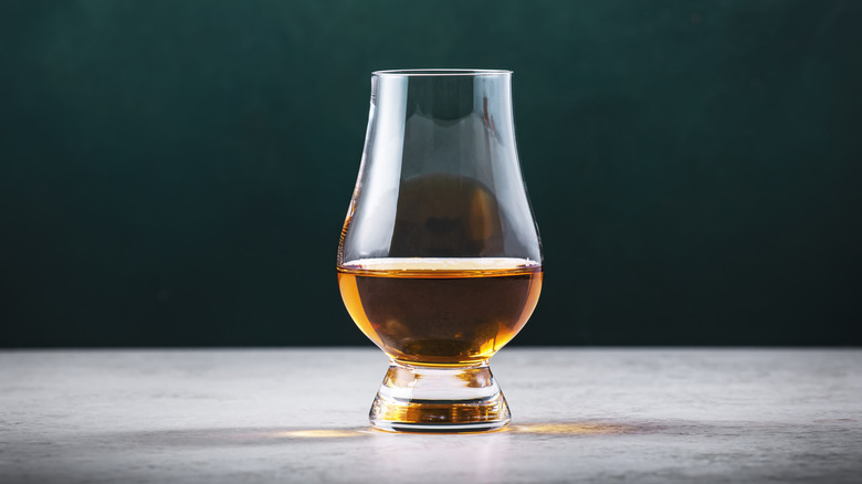 Scotch whisky in a tulip-shaped snifter perfect for capturing the various aromas of a blend or single malt