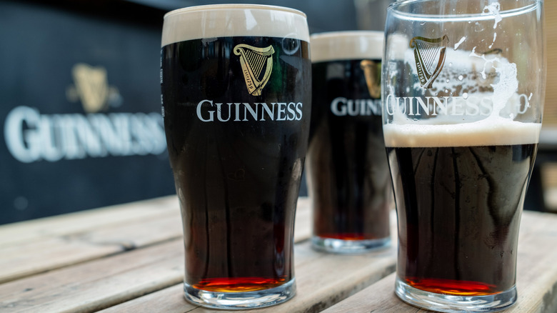 Full and half-empty Guinness glasses