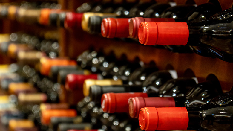 Rows of wine bottles in a cellar