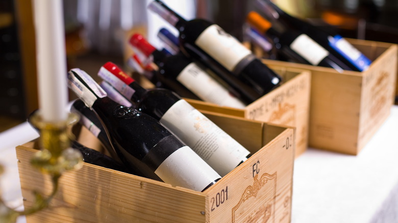 Various wine bottles in wooden boxes
