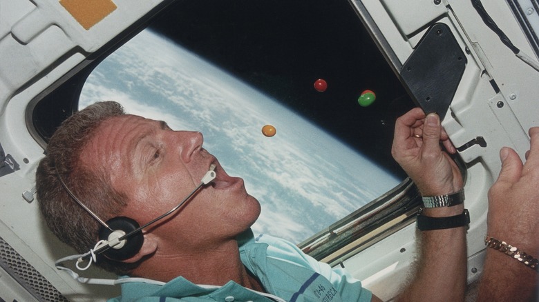 Astronaut eating grapes in space