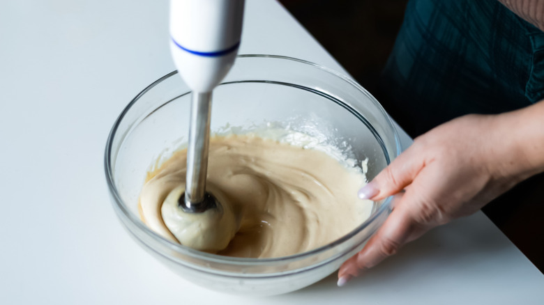 Whisking sauce with immersion blender