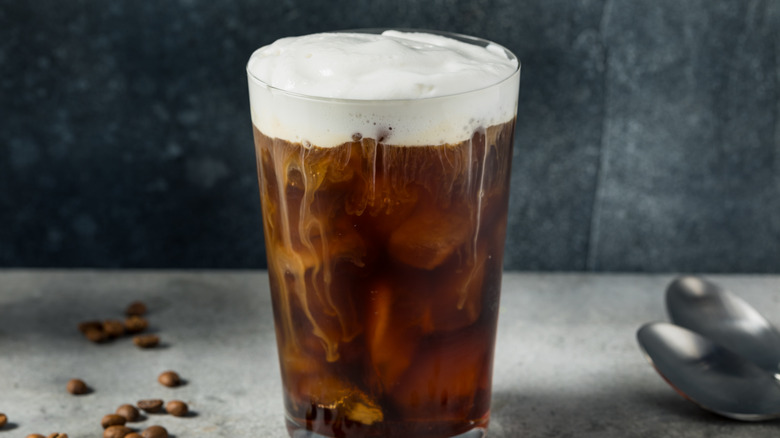 Cold brew coffee in a glass with cold foam