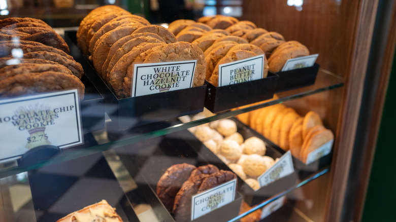 A bakery display case filled with cookies.