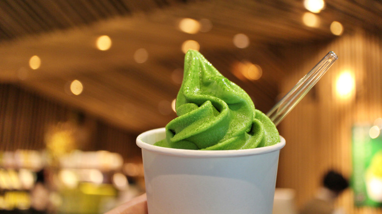 A cup of matcha tea flavored soft serve ice cream