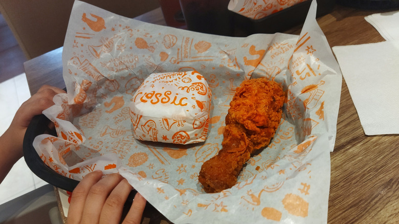 Fried chicken and sandwich from Popeyes on a plate.