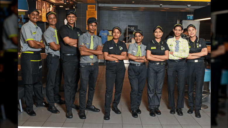 nine McDonald's staff in India posing