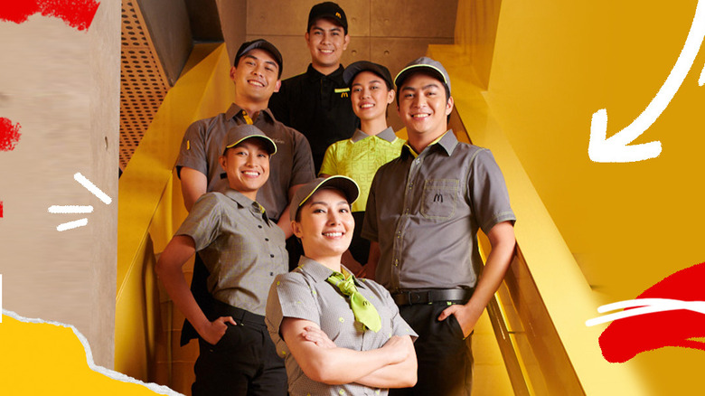 six mcdonald's staff on stairs