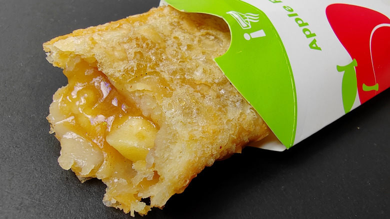 A McDonald's fried apple pie pokes out of its package.