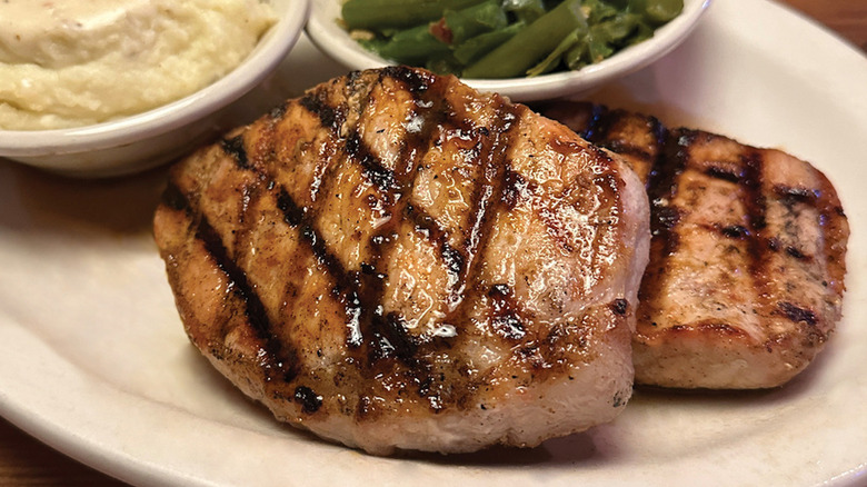 Texas Roadhouse pork chop meal with sides