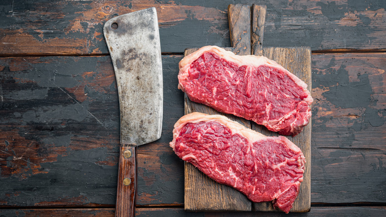 Steak cuts on a wooden plank