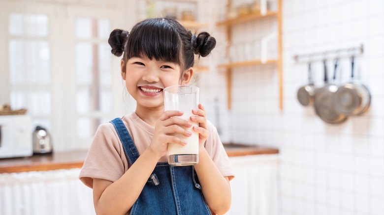 little girl drinking milk