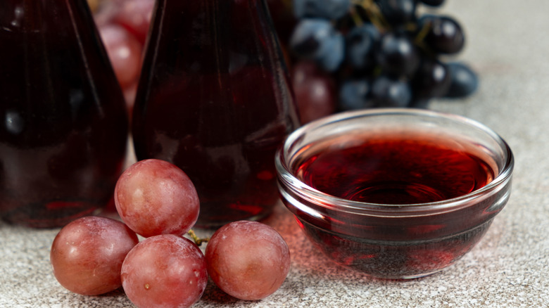 a bowl of red wine vinegar and grapes