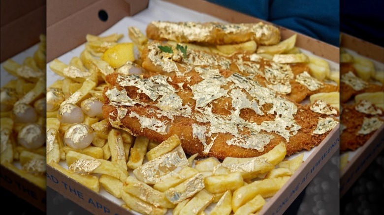 Box of fish and chips with edible gold flakes on top