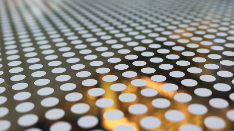 A piece of glass with dots (ceramic frits) on it.