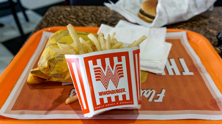 Whataburger fries and burger on a tray